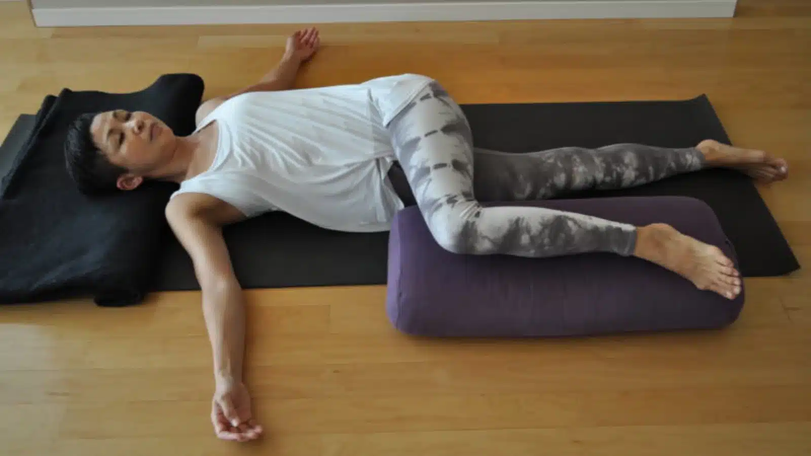 Supported Supine Spinal Twist in Restorative Yoga