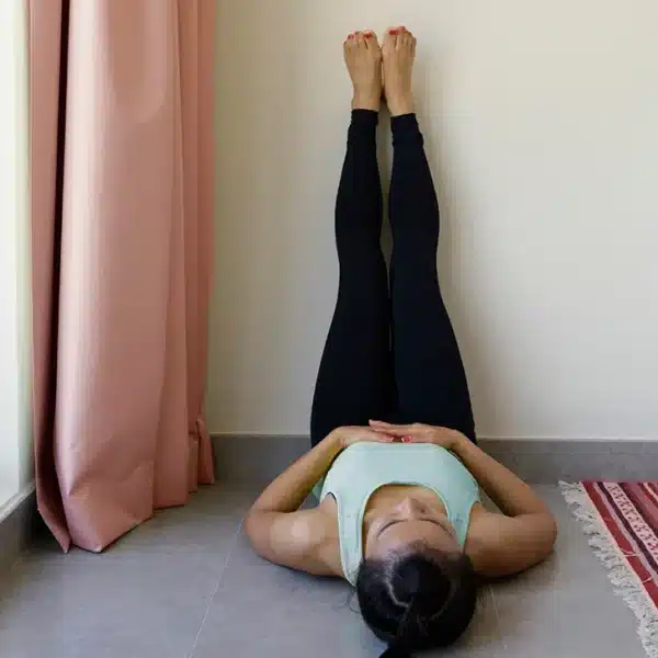 Benefits of Supported Legs-Up-the-Wall Twist in Yoga Practice