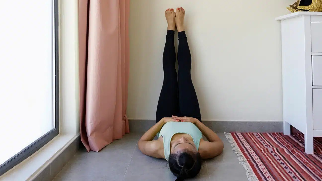 Benefits of Supported Legs-Up-the-Wall Twist in Yoga Practice